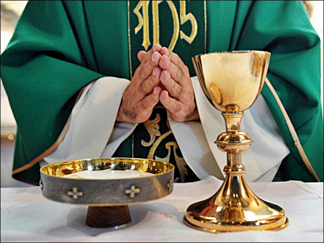 Priest-praying-over-the-Eucharistic-Bread-and-Vine_large